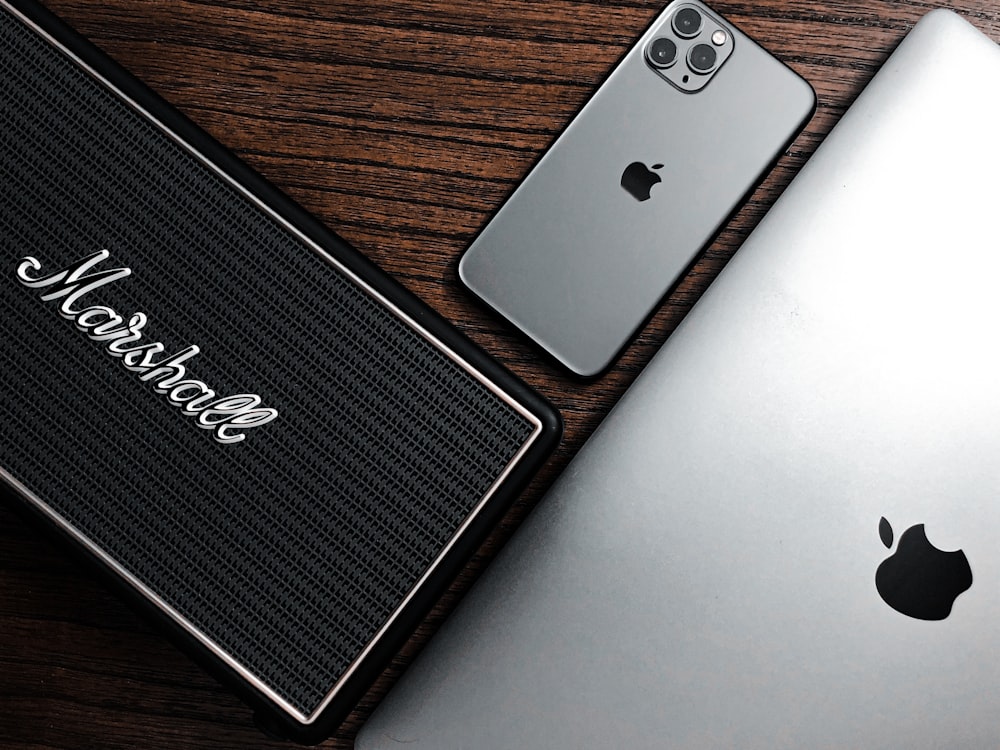 silver ipad on brown wooden table