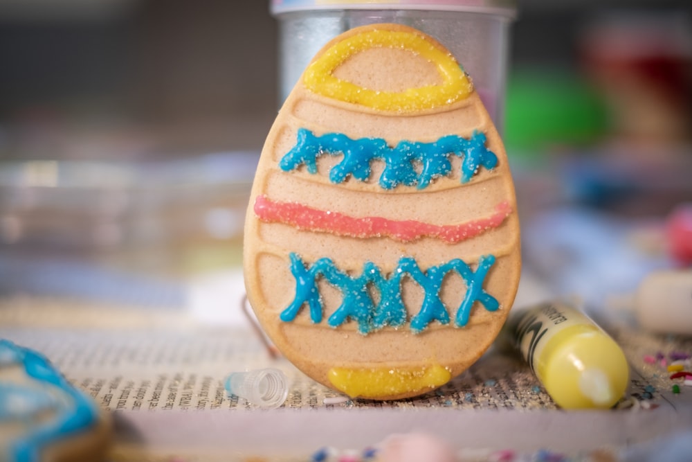 orange and blue ceramic egg ornament