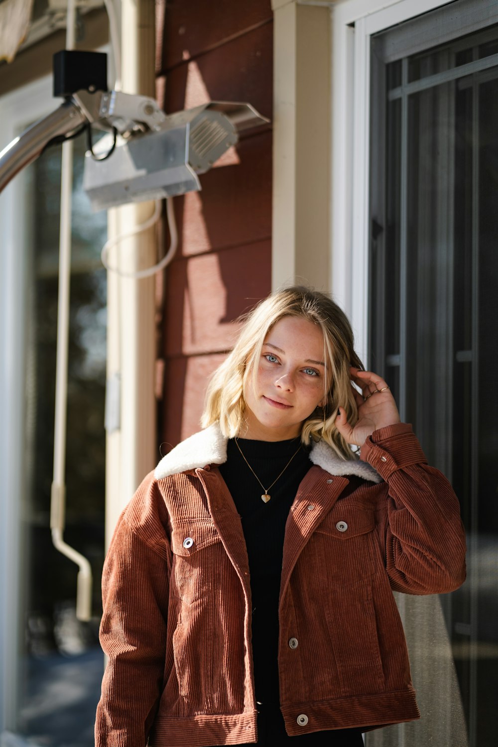 woman in red jacket smiling