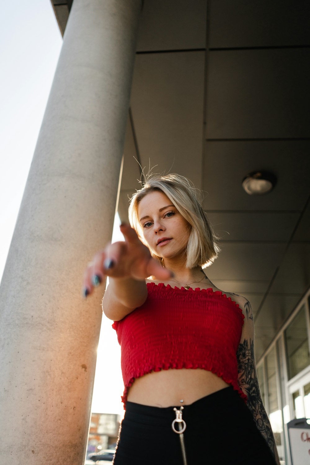 woman in red spaghetti strap top