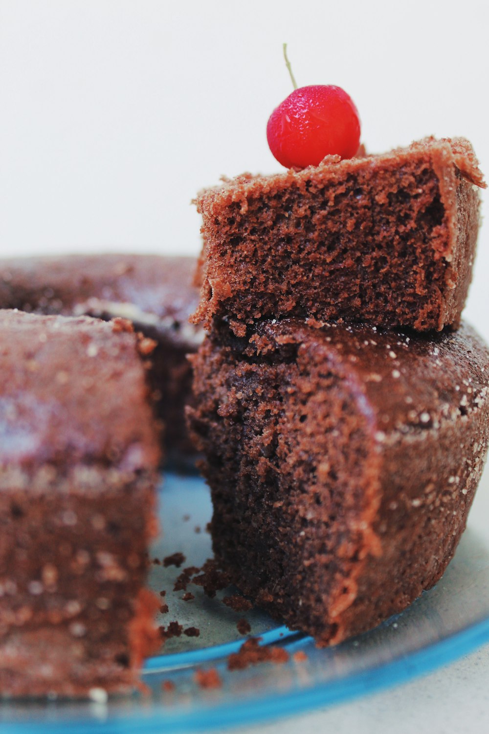 chocolate cake with red cherry on top