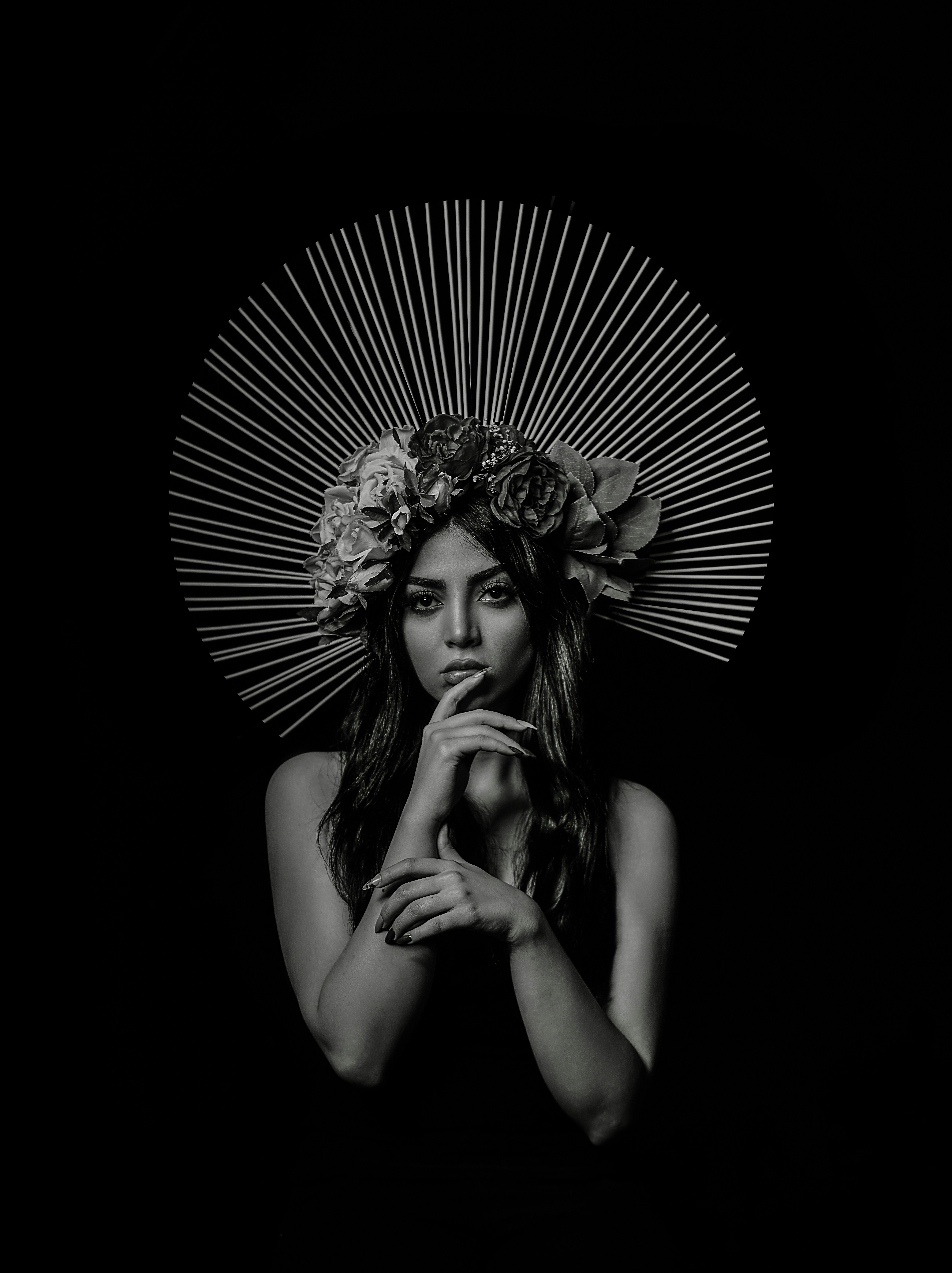 grayscale photo of woman with floral headdress