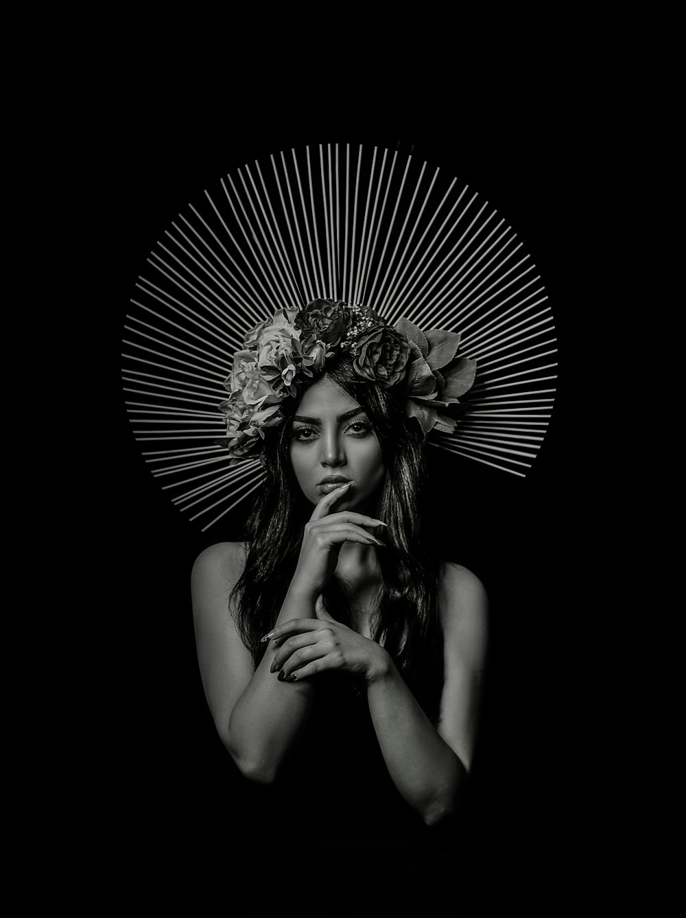 grayscale photo of woman with floral headdress