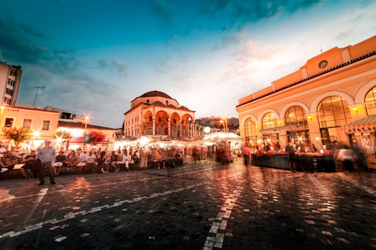 brown and white concrete building during night time in Monastiraki Greece