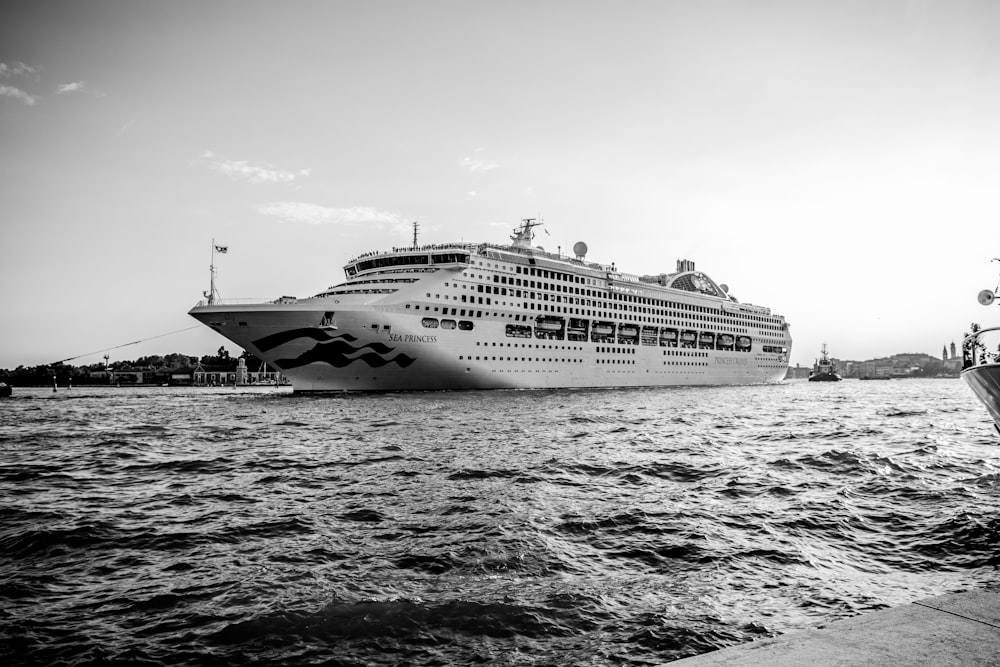 grayscale photo of cruise ship on sea