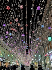 A festive street adorned with twinkling lights and decorations.
