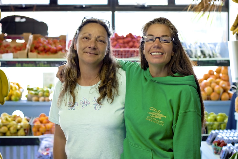 2 women in green crew neck t-shirt