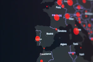 Map with golden points and subtle lines connecting Madrid to international cities.