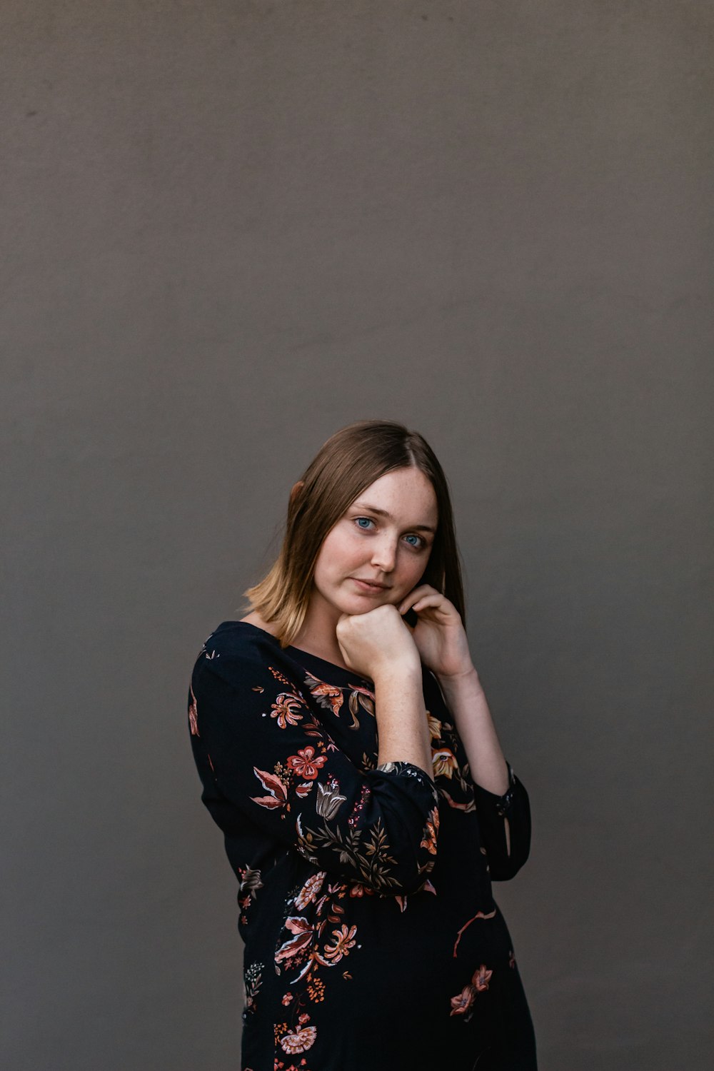 woman in black and white floral long sleeve shirt