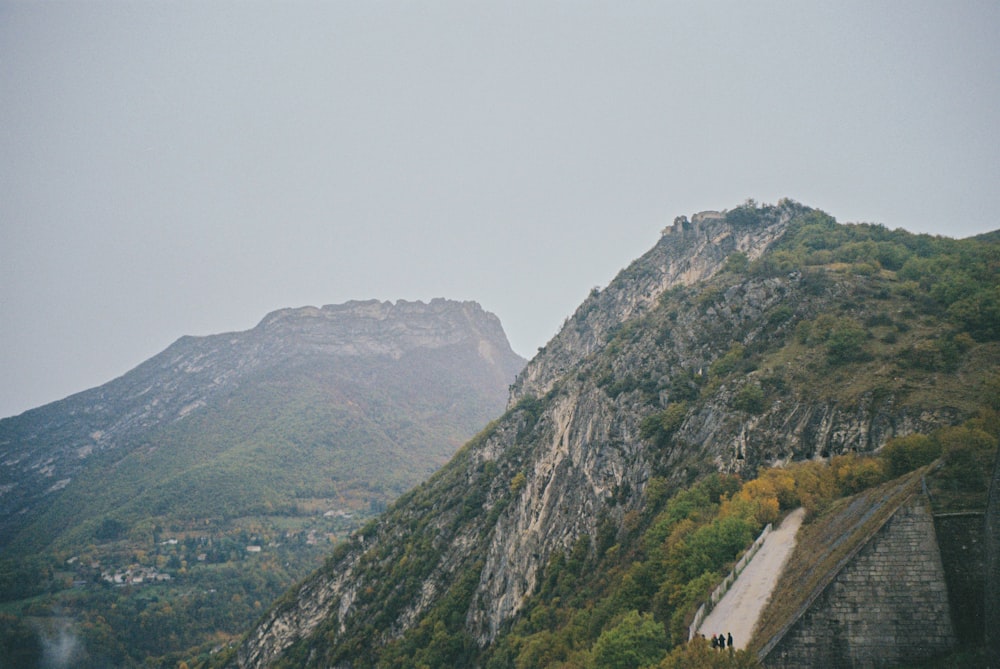 green and brown mountain under white sky during daytime