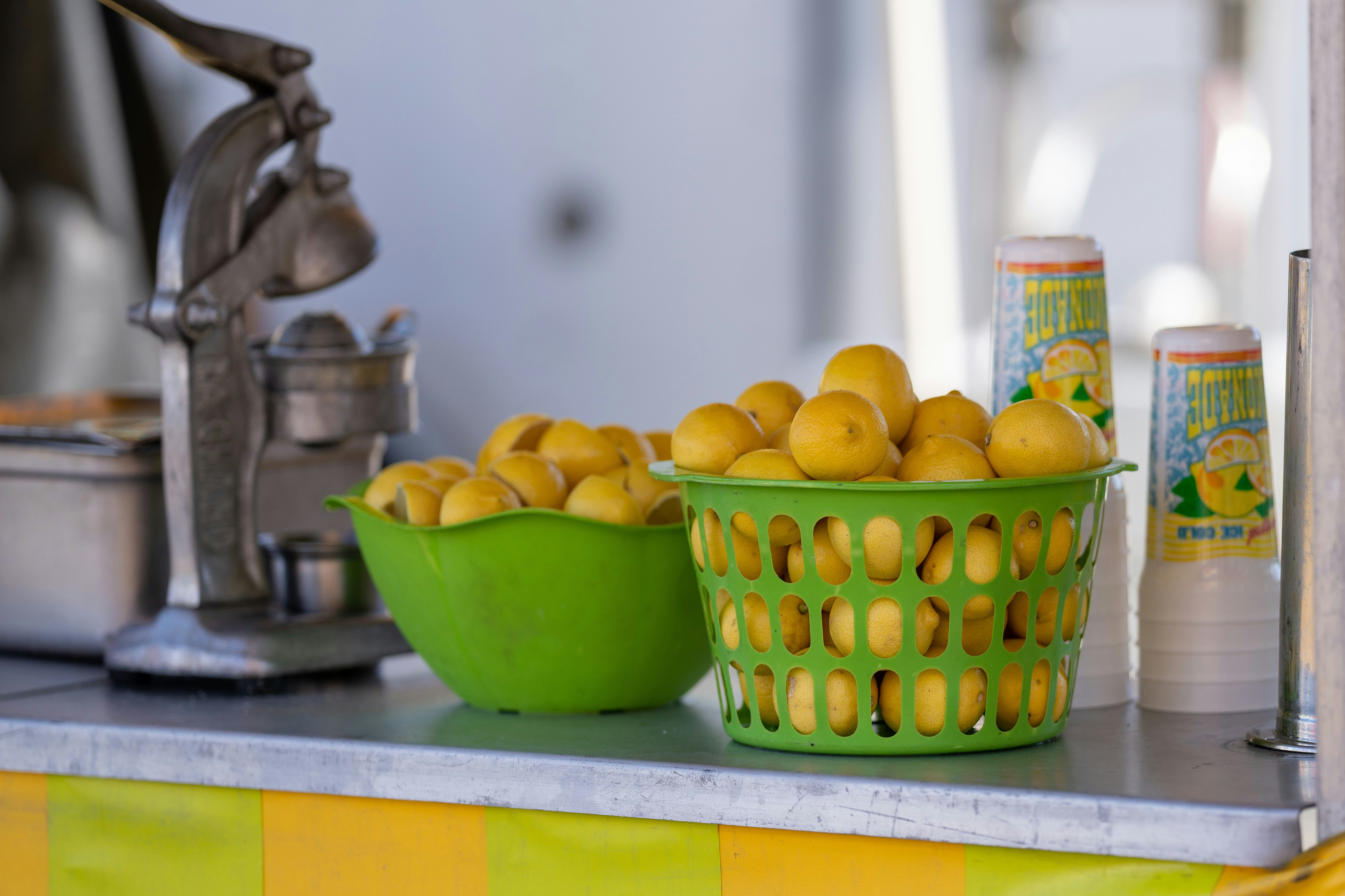 yellow and green apple fruit in green plastic container