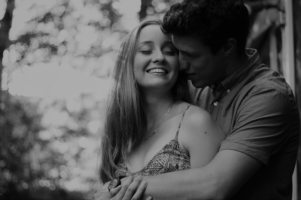 grayscale photo of couple smiling