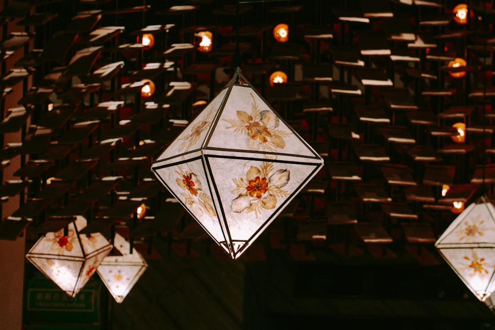 white and brown floral pendant lamp