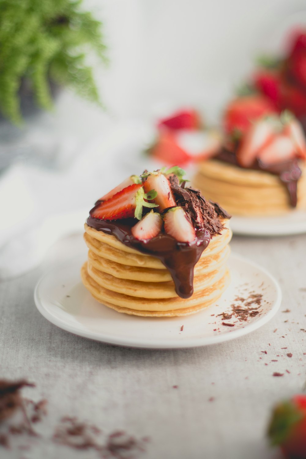 brown waffle with chocolate syrup on white ceramic plate