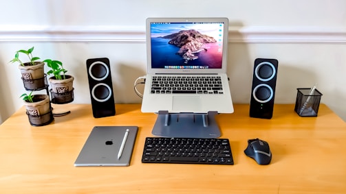 Organized workspace featuring a sleek laptop stand.