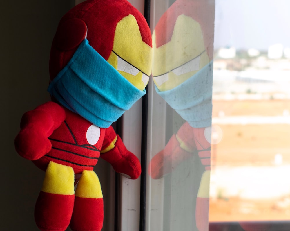 red yellow and blue plush toy