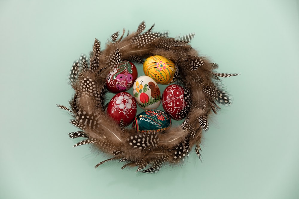 red and gold baubles on brown round wreath