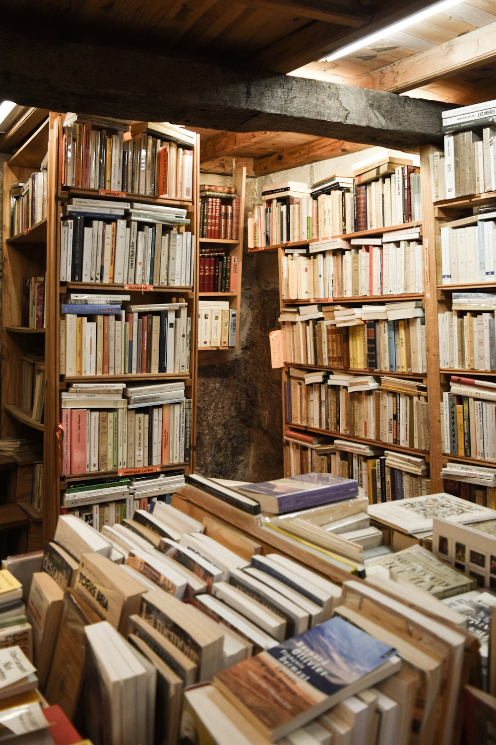 books on brown wooden shelf