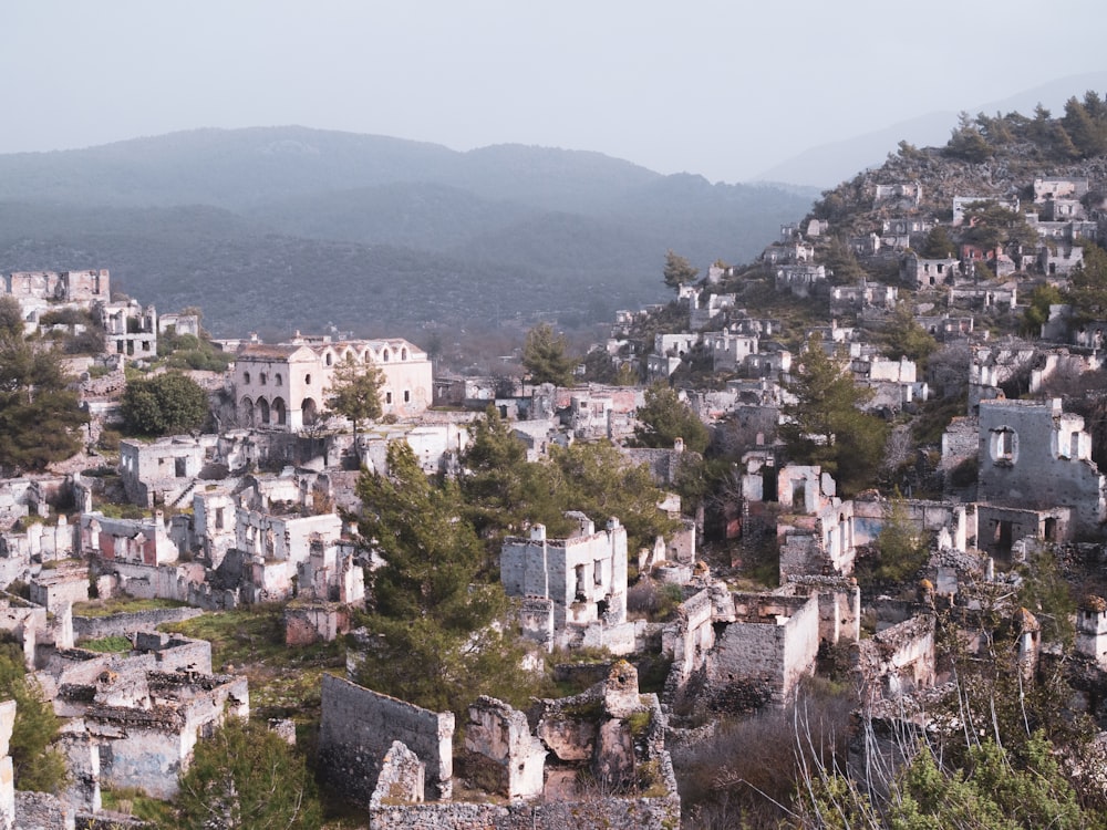 white and brown concrete houses on mountain during daytime