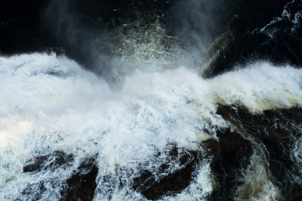 water falls on rocky mountain