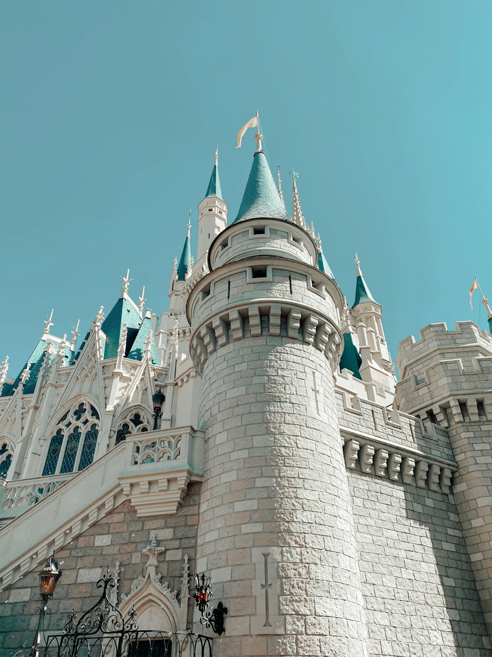 white and blue concrete castle under blue sky during daytime