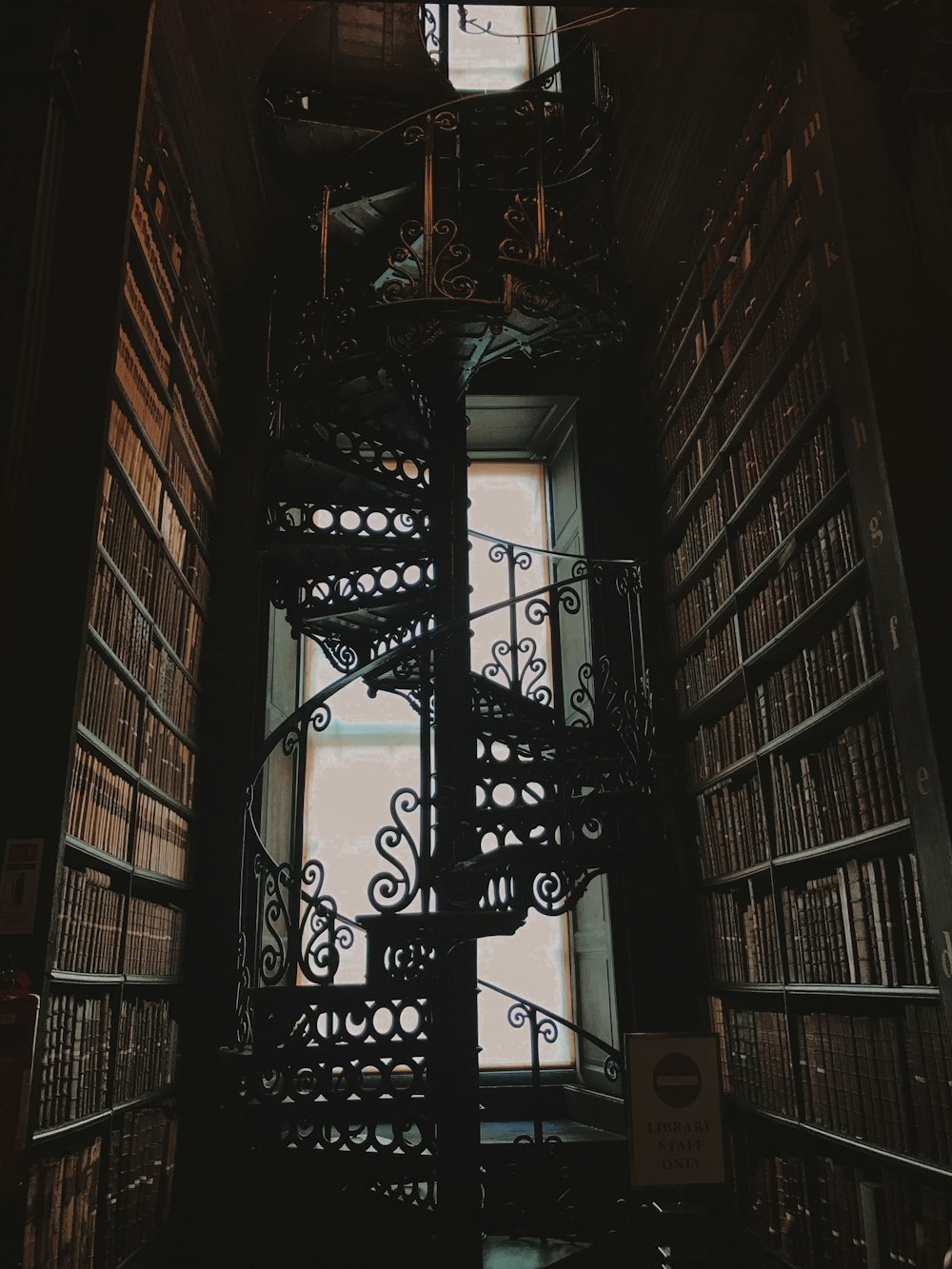 black metal frame on brown wooden wall