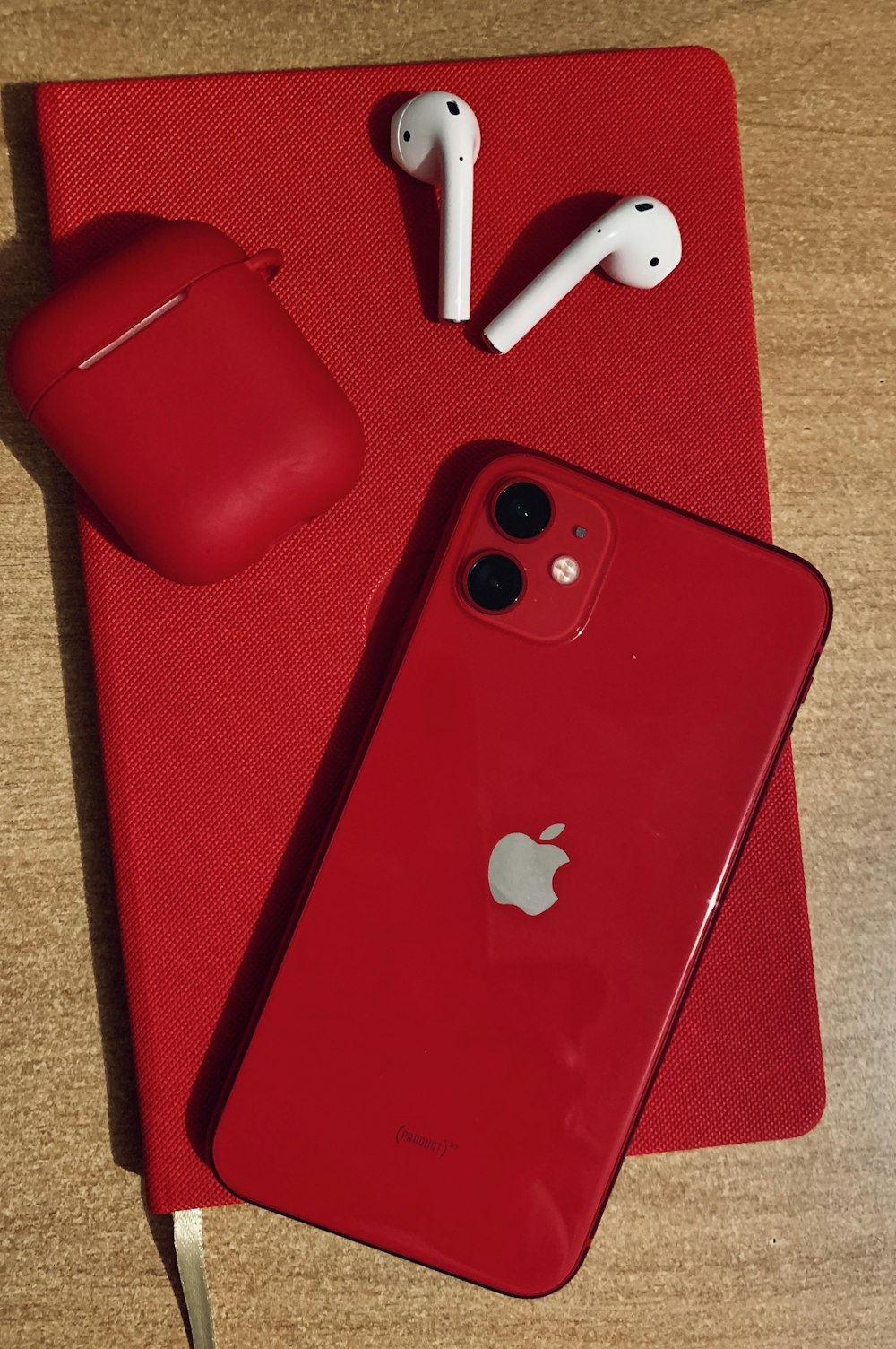 red iphone 7 plus on red textile