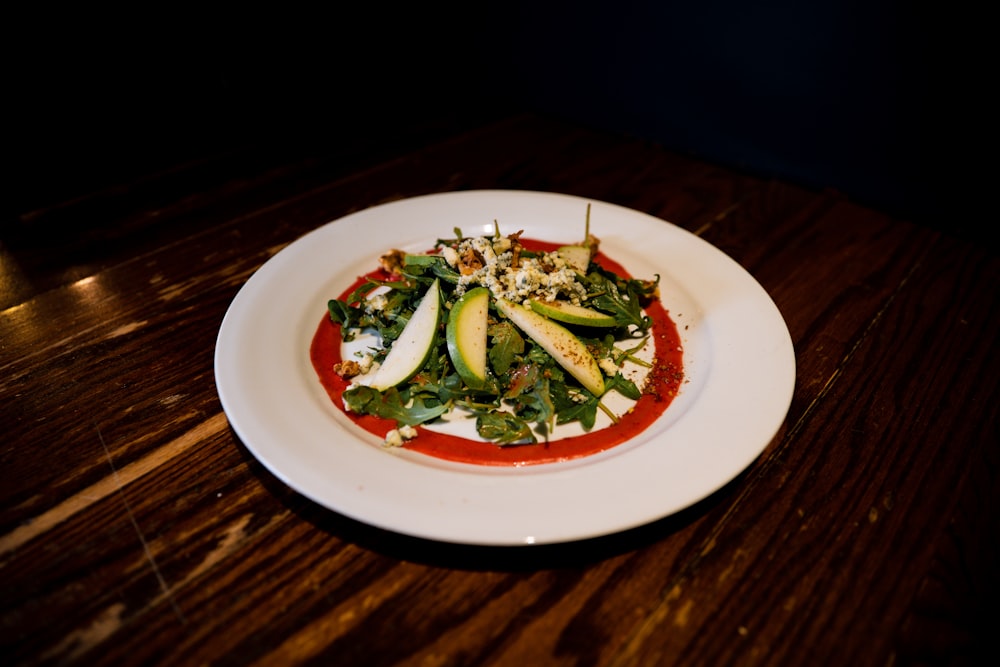 green vegetable on white ceramic plate