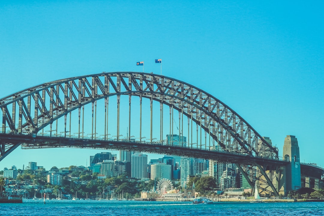 gray metal bridge over blue sky during daytime