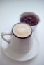 white ceramic mug with cappuccino