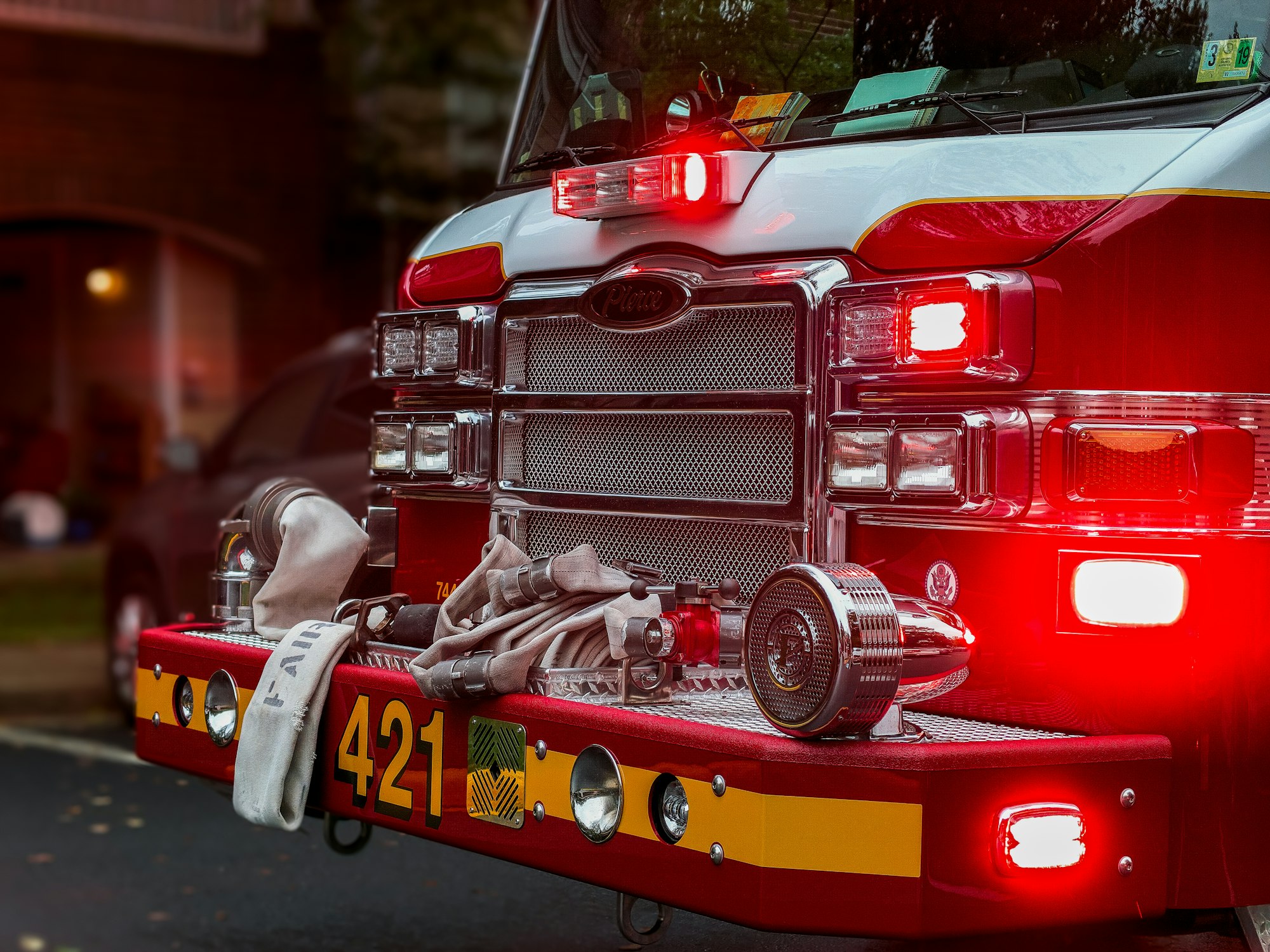 the brightly-lit front of a red fire engine