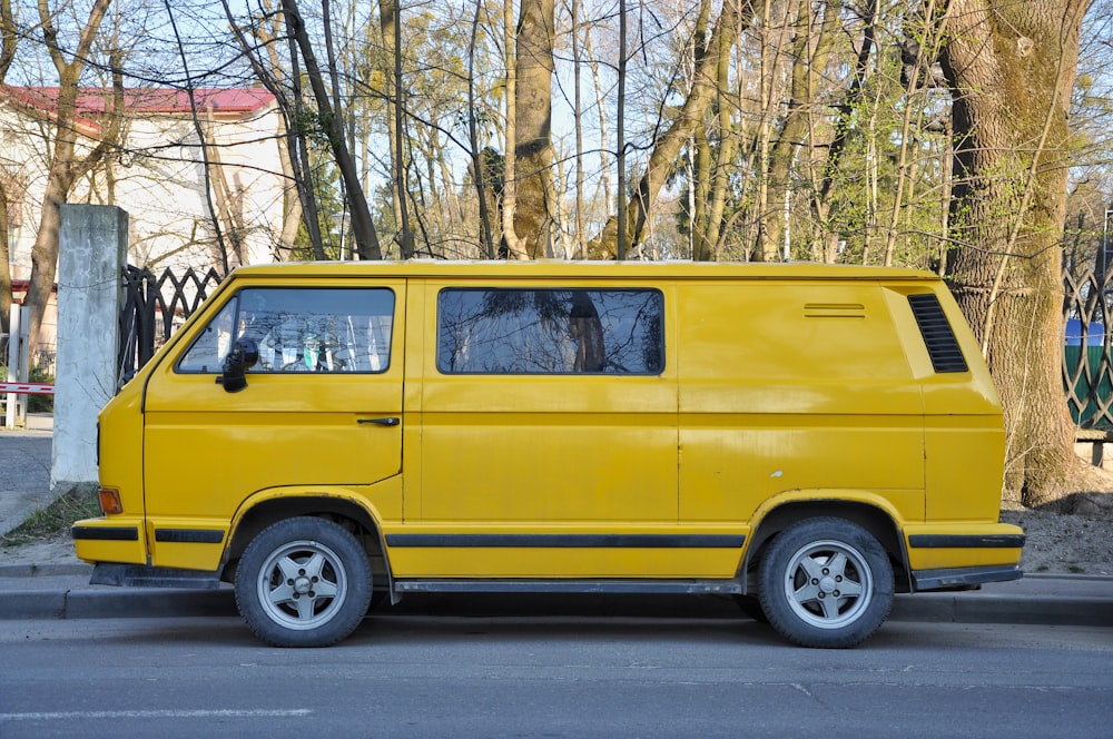 yellow van parked on the side of the road