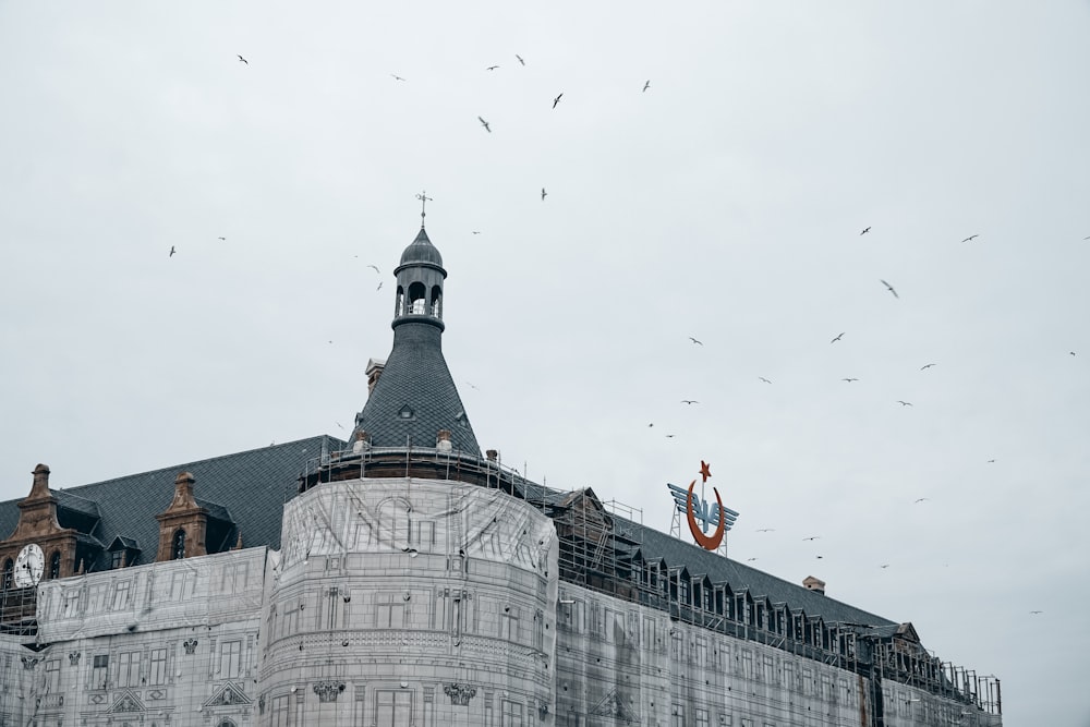 white and brown concrete building under white sky during daytime