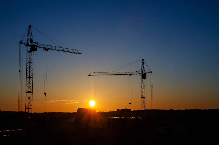 Crane on a VAD Group industrial construction site at dusk