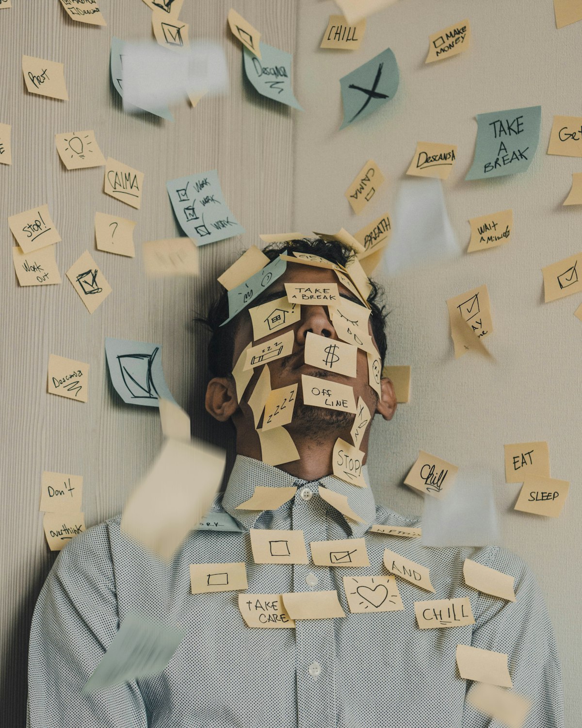 The cost of context switching - man covered in post it notes