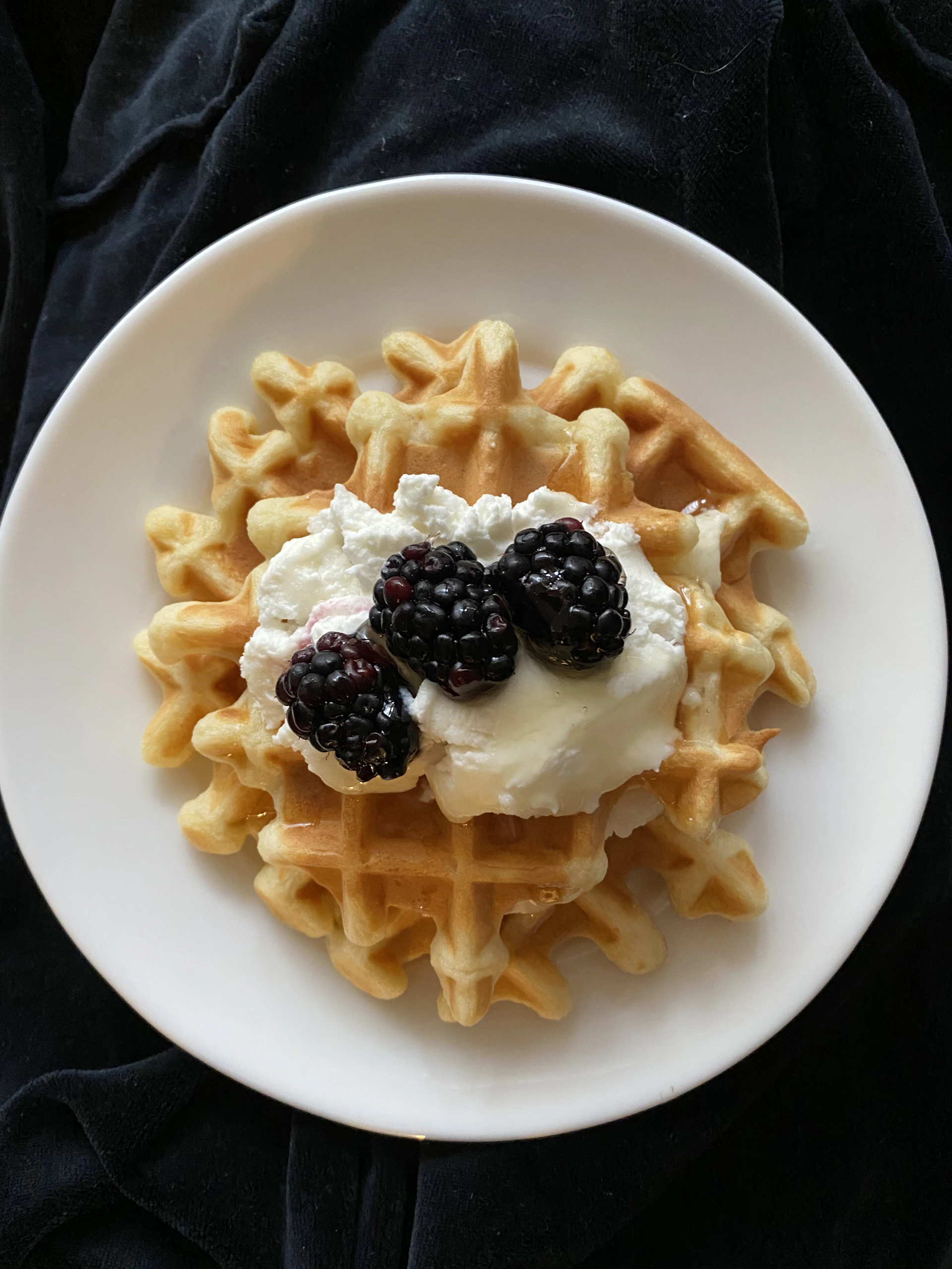 white ceramic plate with black and white berries