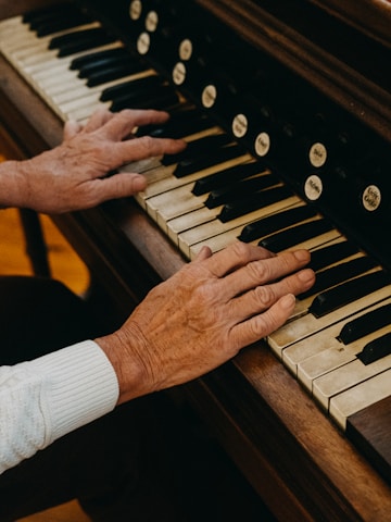 person playing piano during daytime