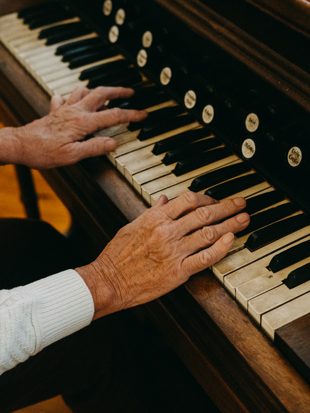 person playing piano during daytime