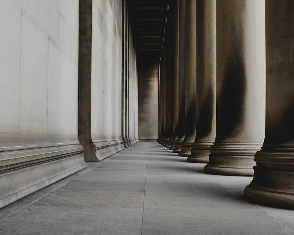 brown concrete pillar on gray concrete floor