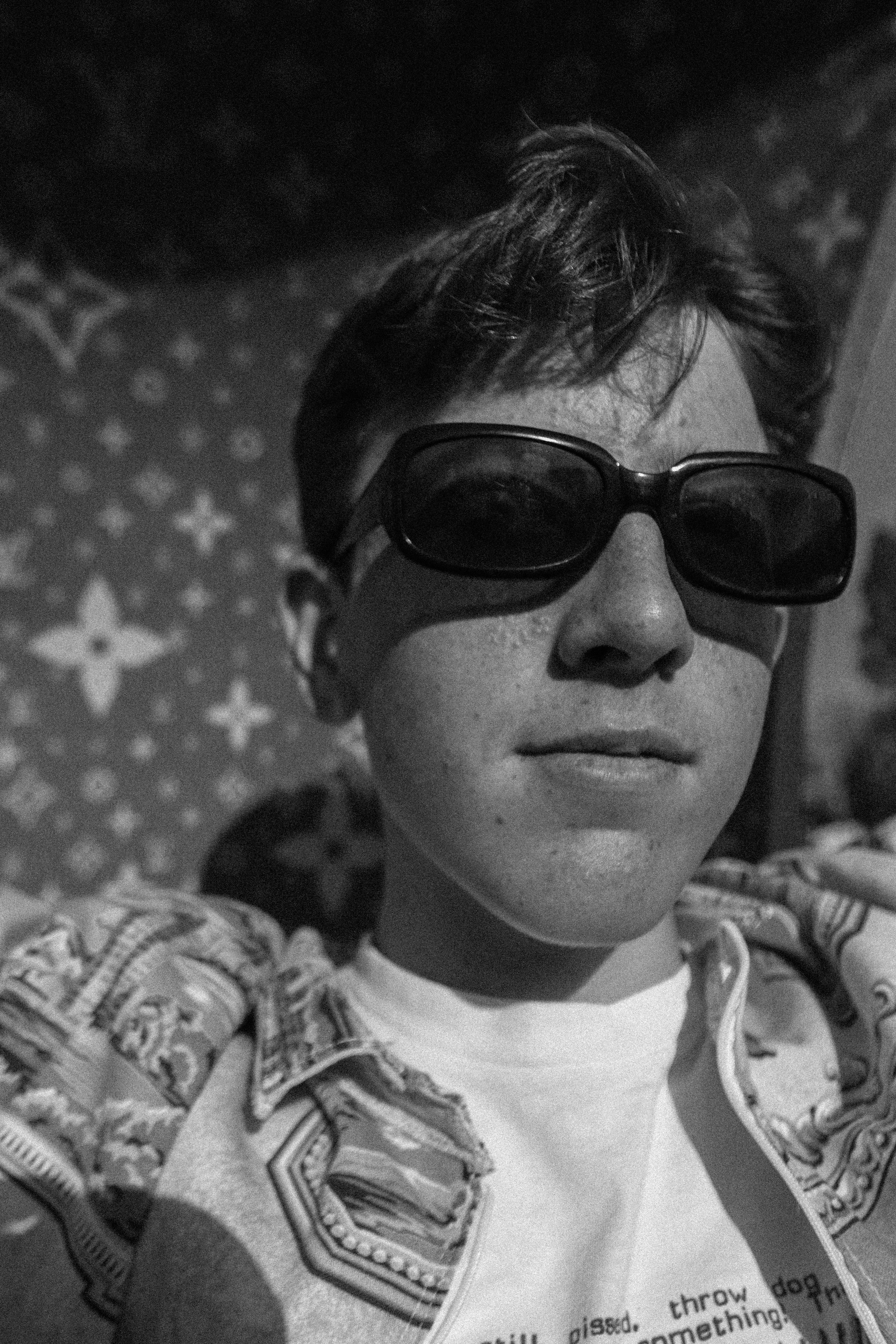 grayscale photo of man wearing sunglasses