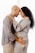 A couple stands closely, facing each other, with their foreheads touching. The man gently holds the woman's waist, while the woman rests her hands on his shoulders. Both are smiling warmly and wearing casual clothing.