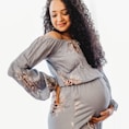 woman in gray long sleeve shirt and brown skirt