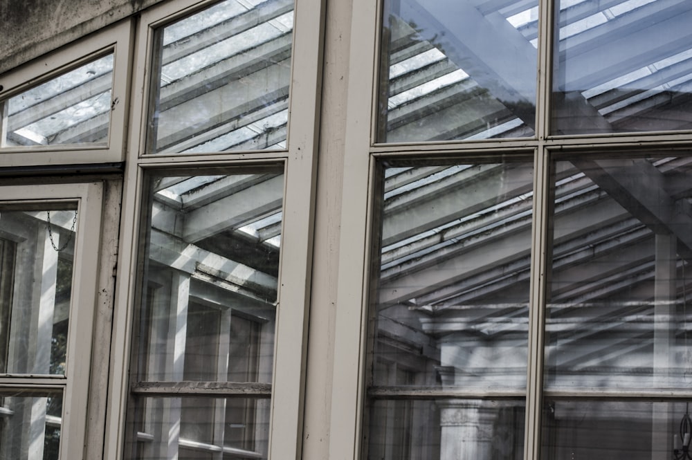 brown wooden framed glass window