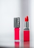 red lipstick on white background
