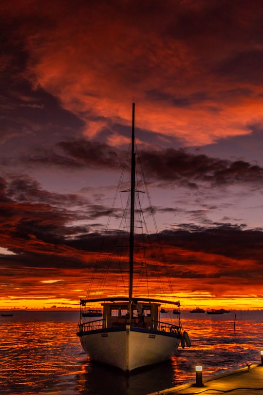 silhouette of boat on sea during sunset in Meeru Island Maldives