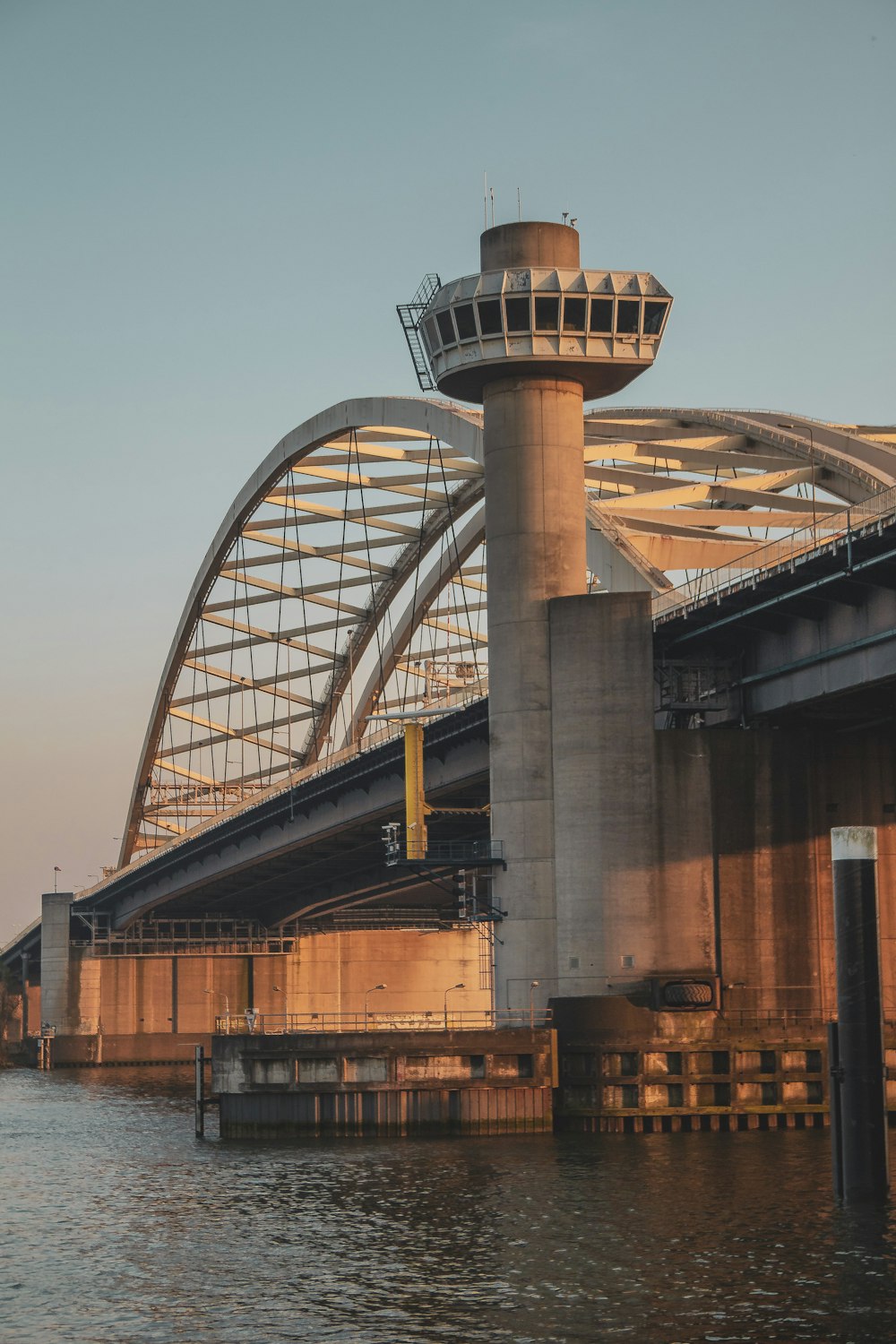 gray concrete bridge over river during daytime