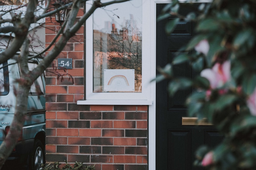 white wooden framed glass window