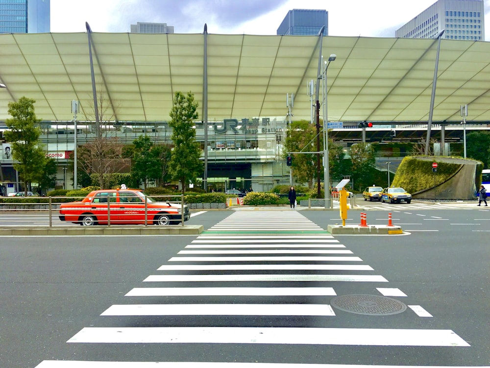 cars parked on parking lot near building during daytime