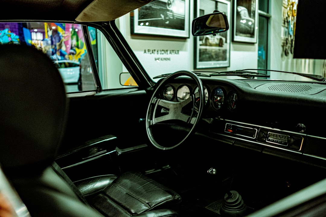 black car steering wheel during daytime