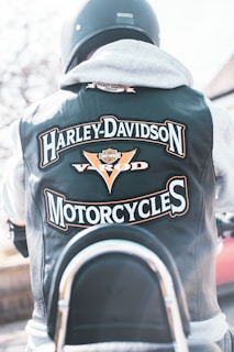 the back of a man wearing a harley davidson motorcycle jacket